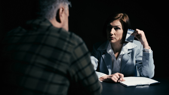detective confronting man